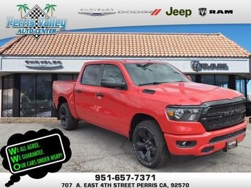 2024 RAM 1500 Tradesman Crew Cab 4x2 5'7' Box in a Flame Red Clear Coat exterior color and Blackinterior. Perris Valley Chrysler Dodge Jeep Ram 951-355-1970 perrisvalleydodgejeepchrysler.com 