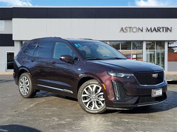 2021 Cadillac XT6 Sport in a Red exterior color and Cirrus/Jet Black Accentsinterior. Glenview Luxury Imports 847-904-1233 glenviewluxuryimports.com 