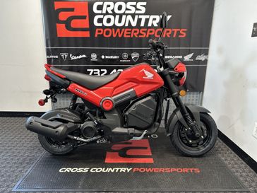 2023 Honda Navi in a RED exterior color. Cross Country Powersports 732-491-2900 crosscountrypowersports.com 