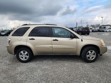 2005 Chevrolet Equinox LS in a Sandstone Metallic exterior color and Light Cashmereinterior. Wilmington Auto Center Chrysler Dodge Jeep Ram (937) 556-6430 wilmingtonautocentercdjr.com 