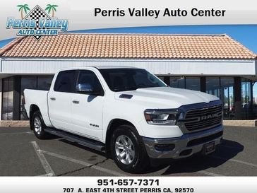 2022 RAM 1500 Laramie in a Bright White Clear Coat exterior color and Blackinterior. Perris Valley Chrysler Dodge Jeep Ram 951-355-1970 perrisvalleydodgejeepchrysler.com 