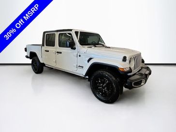 2023 Jeep Gladiator Sport S 4x4 in a Bright White Clear Coat exterior color and Blackinterior. Sheridan Motors CDJR 307-218-2217 sheridanmotor.com 