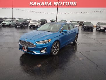 2020 Ford Fusion Titanium in a Blue exterior color. Sahara Motors Inc 435-500-5052 saharamotorschryslerdodgejeep.com 