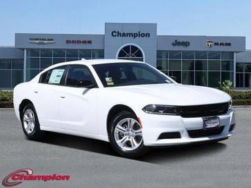 2023 Dodge Charger SXT Rwd in a White Knuckle exterior color and HOUNDSTOOTHinterior. Champion Chrysler Jeep Dodge Ram 800-549-1084 pixelmotiondemo.com 
