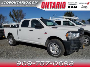 2019 RAM 2500 Tradesman in a Bright White Clear Coat exterior color and Diesel Gray/Blackinterior. Ontario Auto Center ontarioautocenter.com 