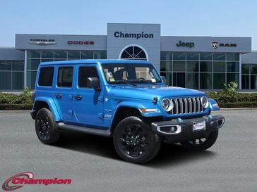 2024 Jeep Wrangler 4-door Sahara 4xe in a Hydro Blue Pearl Coat exterior color and CLOTHinterior. Champion Chrysler Jeep Dodge Ram 800-549-1084 pixelmotiondemo.com 
