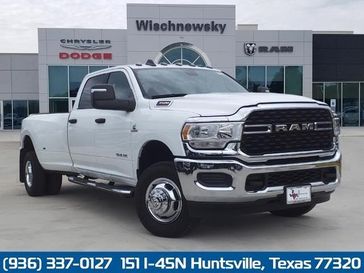 2024 RAM 3500 Lone Star Crew Cab 4x4 8' Box in a Bright White Clear Coat exterior color and Diesel Gray/Blackinterior. Wischnewsky Dodge 936-755-5310 wischnewskydodge.com 