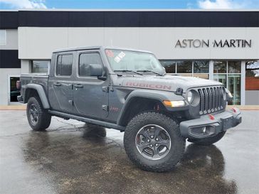 2022 Jeep Gladiator Rubicon in a Granite Crystal Metallic Clear Coat exterior color and Blackinterior. Glenview Luxury Imports 847-904-1233 glenviewluxuryimports.com 