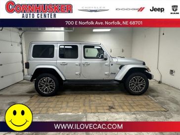 2024 Jeep Wrangler 4xE High Altitude in a Silver Zynith Clear Coat exterior color and Blackinterior. Cornhusker Auto Center 402-866-8665 cornhuskerautocenter.com 