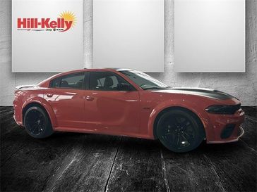 2023 Dodge Charger Scat Pack Widebody in a Go Mango exterior color. Hill-Kelly Dodge (850) 786-2130 hillkellydodge.com 
