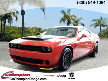 2023 Dodge Challenger SRT Hellcat Redeye Widebody in a GO MANGO exterior color and 170 ALCANTARAinterior. Champion Chrysler Jeep Dodge Ram 800-549-1084 pixelmotiondemo.com 