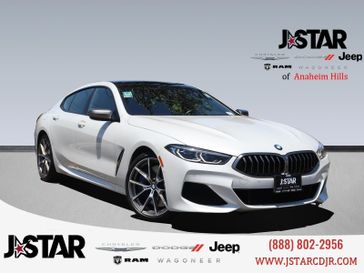 2021 BMW 8 Series Gran Coupe M850i xDrive Coupe in a White Metallic exterior color and Night Blue/Blackinterior. J Star Chrysler Dodge Jeep Ram of Anaheim Hills 888-802-2956 jstarcdjrofanaheimhills.com 