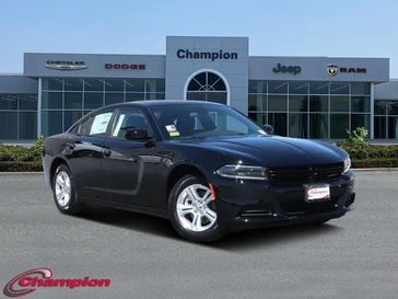 2023 Dodge Charger SXT Rwd in a Pitch Black exterior color and HOUNDSTOOTHinterior. Champion Chrysler Jeep Dodge Ram 800-549-1084 pixelmotiondemo.com 