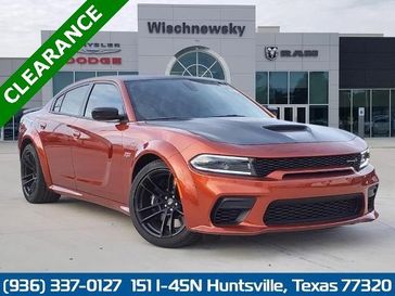 2023 Dodge Charger Scat Pack Widebody in a Sinamon Stick exterior color and Blackinterior. Wischnewsky Dodge 936-755-5310 wischnewskydodge.com 