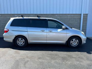 2005 Honda Odyssey EX-L in a Silver Pearl Metallic exterior color and Grayinterior. Wilmington Auto Center Chrysler Dodge Jeep Ram (937) 556-6430 wilmingtonautocentercdjr.com 