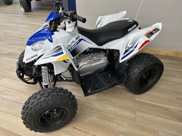 2025 Polaris Outlaw in a VELOCITY BLUE / LIFTED LIME exterior color. Up North Power & Sports 218-237-5670 upnorthpowermn.com 