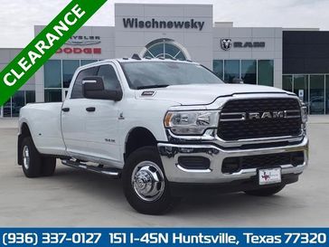 2024 RAM 3500 Lone Star Crew Cab 4x4 8' Box in a Bright White Clear Coat exterior color and Diesel Gray/Blackinterior. Wischnewsky Dodge 936-755-5310 wischnewskydodge.com 