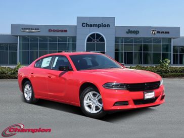 2023 Dodge Charger SXT Rwd in a TorRed exterior color and HOUNDSTOOTHinterior. Champion Chrysler Jeep Dodge Ram 800-549-1084 pixelmotiondemo.com 