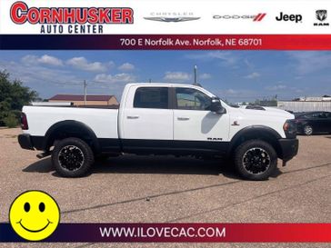 2023 RAM 2500 Rebel Crew Cab 4x4 6'4' Box in a Bright White Clear Coat exterior color and Blackinterior. Cornhusker Auto Center 402-866-8665 cornhuskerautocenter.com 