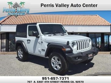 2022 Jeep Wrangler Sport S in a Bright White Clear Coat exterior color and Blackinterior. Perris Valley Chrysler Dodge Jeep Ram 951-355-1970 perrisvalleydodgejeepchrysler.com 