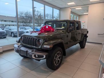 2024 Jeep Gladiator Sport S 4x4 in a Sarge Green Clear Coat exterior color and Blackinterior. Brattleboro CDJR 802-251-1111 brattleborocdjr.com 