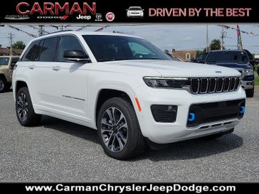 2023 Jeep Grand Cherokee Overland 4xe in a Bright White Clear Coat exterior color and Global Black - BLX7interior. Carman Chrysler Jeep Dodge Ram 302-317-2378 carmanchryslerjeepdodge.com 