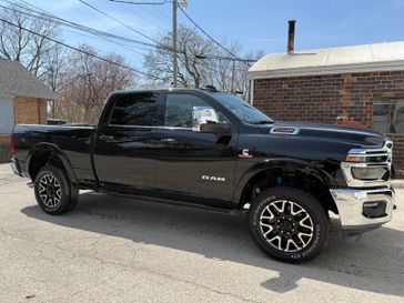 2025 RAM 2500 Limited Longhorn Crew Cab 4x4 6'4' Box in a Diamond Black Crystal Pearl Coat exterior color. Hometown Motors of Rockwell City 712-220-7644 hometownmotorsrc.com 