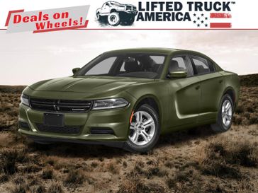 2023 Dodge Charger SXT in a F8 Green exterior color and Blackinterior. Lifted Truck America 888-267-0644 liftedtruckamerica.com 