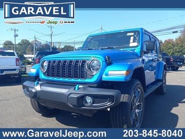 2024 Jeep Wrangler 4-door Sport S 4xe in a Hydro Blue Pearl Coat exterior color and Blackinterior. Garavel Jeep 475-258-7987 norwalkjeep.com 