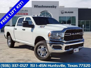 2024 RAM 2500 Tradesman Crew Cab 4x4 6'4' Box in a Bright White Clear Coat exterior color and Blackinterior. Wischnewsky Dodge 936-755-5310 wischnewskydodge.com 