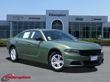 2023 Dodge Charger SXT Rwd in a F8 Green exterior color and HOUNDSTOOTHinterior. Champion Chrysler Jeep Dodge Ram 800-549-1084 pixelmotiondemo.com 