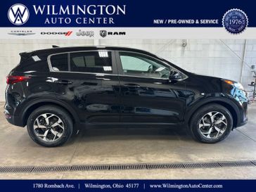 Used 2022 Kia Sportage LX in a Black Cherry exterior color and Blackinterior. Wilmington Auto Center Chrysler Dodge Jeep Ram (937) 556-4751 wilmingtonautocentercdjr.com 