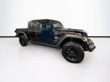 2023 Jeep Gladiator Mojave 4x4 in a Black Clear Coat exterior color and Blackinterior. Sheridan Motors CDJR 307-218-2217 sheridanmotor.com 