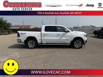 2021 RAM 1500 Longhorn in a Bright White Clear Coat exterior color and Black/New Saddleinterior. Cornhusker Auto Center 402-866-8665 cornhuskerautocenter.com 