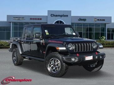 2024 Jeep Gladiator Rubicon 4x4 in a Black Clear Coat exterior color and CLOTHinterior. Champion Chrysler Jeep Dodge Ram 800-549-1084 pixelmotiondemo.com 