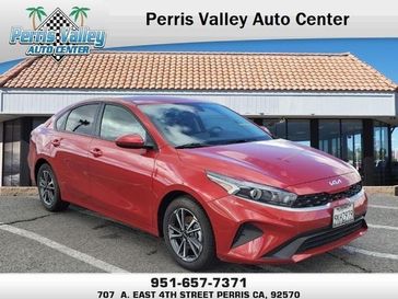 2023 Kia Forte LXS in a Currant Red exterior color and Blackinterior. Perris Valley Chrysler Dodge Jeep Ram 951-355-1970 perrisvalleydodgejeepchrysler.com 
