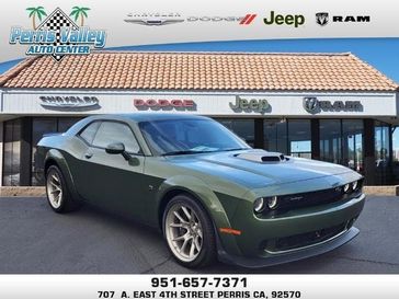 2023 Dodge Challenger Scat Pack Swinger in a F8 Green exterior color and -X9interior. Perris Valley Chrysler Dodge Jeep Ram 951-355-1970 perrisvalleydodgejeepchrysler.com 