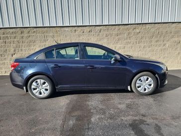 2014 Chevrolet Cruze LS in a Blue Ray Metallic exterior color and Jet Black/Medium Titaniuminterior. Wilmington Auto Center Chrysler Dodge Jeep Ram (937) 556-6430 wilmingtonautocentercdjr.com 