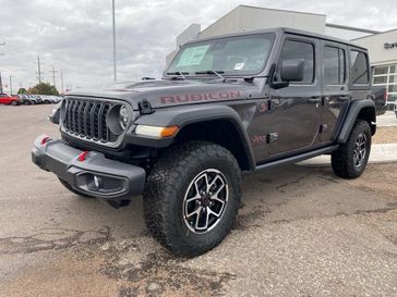 2024 Jeep Wrangler 4-door Rubicon in a Granite Crystal Metallic Clear Coat exterior color and Blackinterior. Legacy Auto Center 620-315-9264 legacyautocenter.net 