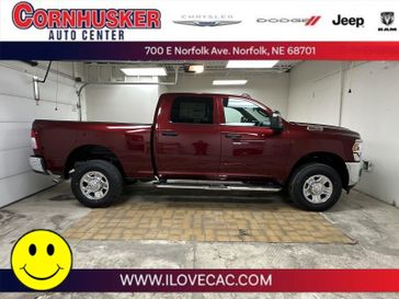 2024 RAM 2500 Tradesman in a Delmonico Red Pearl Coat exterior color and TXX8interior. Cornhusker Auto Center 402-866-8665 cornhuskerautocenter.com 