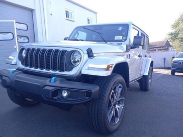 2024 Jeep Wrangler 4-door Sport S 4xe in a Silver Zynith Clear Coat exterior color and Blackinterior. Garavel Jeep 475-258-7987 norwalkjeep.com 