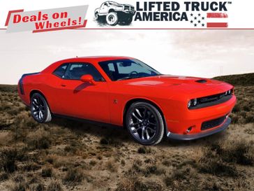 2023 Dodge Challenger R/T Scat Pack in a Go Mango exterior color and Blackinterior. Lifted Truck America 888-267-0644 liftedtruckamerica.com 