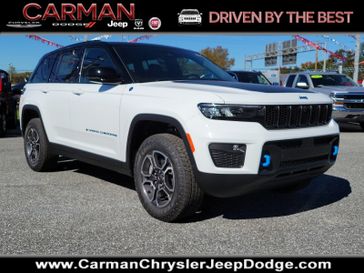 2024 Jeep Grand Cherokee Trailhawk 4xe in a Bright White Clear Coat exterior color and Global Black - E6X7interior. Carman Chrysler Jeep Dodge Ram 302-317-2378 carmanchryslerjeepdodge.com 