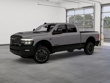 New 2026 RAM 2500 Rebel Crew Cab 4x4 6'4' Box in a Ceramic Gray Clear Coat exterior color. Kamaaina Motors 1-808-746-7956 kamaainamotors.com 