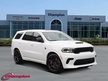 2023 Dodge Durango Srt Hellcat Plus Awd in a White Knuckle Clear Coat exterior color and HIGH PERF LAGUNinterior. Champion Chrysler Jeep Dodge Ram 800-549-1084 pixelmotiondemo.com 