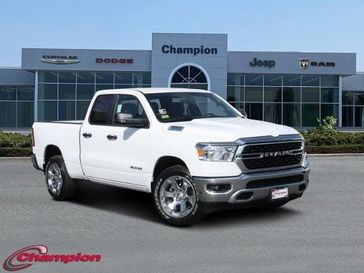 2024 RAM 1500 Big Horn Quad Cab 4x2 6'4' Box in a Bright White Clear Coat exterior color and CLOTH BENCHinterior. Champion Chrysler Jeep Dodge Ram 800-549-1084 pixelmotiondemo.com 