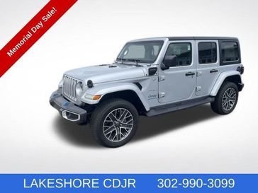 2023 Jeep Wrangler Sahara 4xe in a Silver Zynith Clear Coat exterior color and Blackinterior. Lakeshore CDJR Seaford 302-213-6058 lakeshorecdjr.com 
