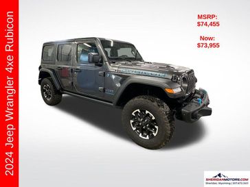 2024 Jeep Wrangler 4-door Rubicon 4xe in a Granite Crystal Metallic Clear Coat exterior color and Blackinterior. Sheridan Motors CDJR 307-218-2217 sheridanmotor.com 