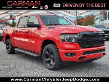 2024 RAM 1500 Tradesman Crew Cab 4x4 5'7' Box in a Flame Red Clear Coat exterior color and Black - V9X9interior. Carman Chrysler Jeep Dodge Ram 302-317-2378 carmanchryslerjeepdodge.com 