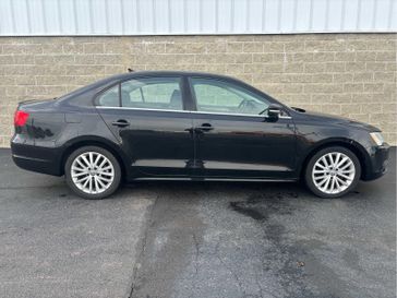 2014 Volkswagen Jetta TDI w/Premium/Nav in a Black Uni exterior color and Titan Blackinterior. Wilmington Auto Center Chrysler Dodge Jeep Ram (937) 556-6430 wilmingtonautocentercdjr.com 